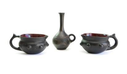 Two black decorative ceramic pots and small jug isolated