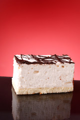 Appetizing cakes on red background
