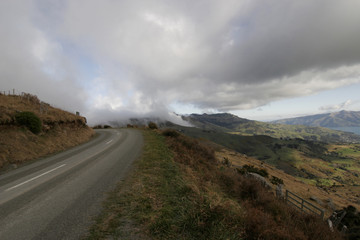 Clouds on a street close to Akaroa in New Zealand