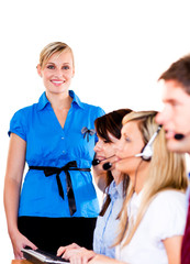Businesswoman with her team in a call center