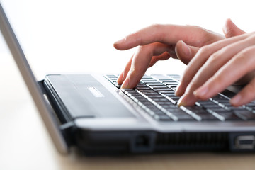 Hands over keyboard
