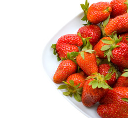 Fresh strawberries on a platter isolated on white