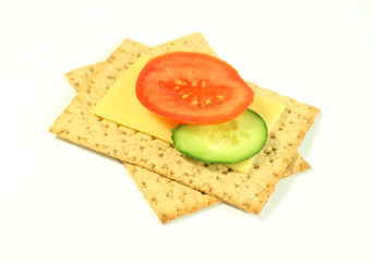 Tomatoes ogrurets and cheese on a white background
