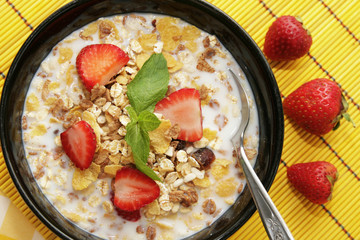 Bowl with cereals and strawberries