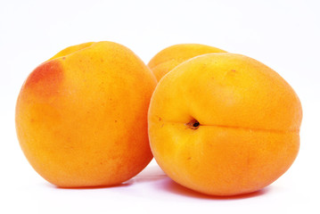Fresh apricots on white background