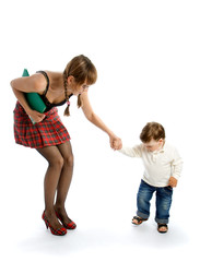 Young woman with a folder holding the hand of child