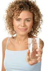 Young woman with glass of mineral water