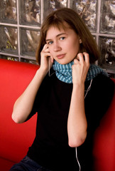 Fototapeta na wymiar Girl in Blue Scarf Listening Music