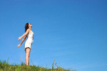 Woman feeling freedom surrounded by summer colors