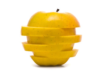 Obraz na płótnie Canvas Sliced yellow apple on studio white