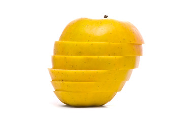 Fototapeta na wymiar Sliced yellow apple on studio white