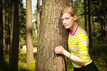 Girl standing near tree