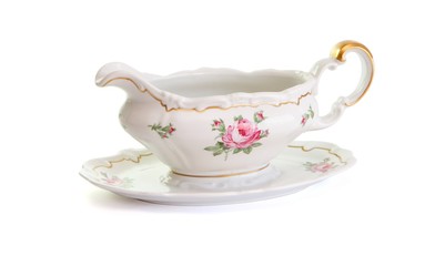 Vintage porcelain sauce-boat isolated on white background