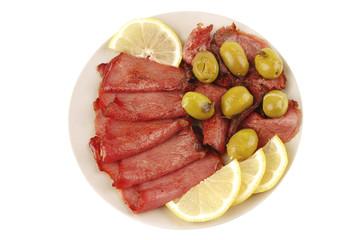 sliced served sausage with raw lemon