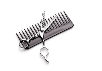 hairstyle concept; scisssors and comb