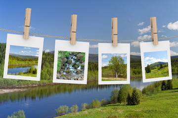 Landscape photographs hanging on clothesline. 3D image