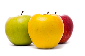 red, yellow and green fresh apples on studio white