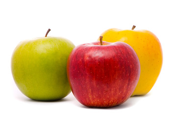 red, yellow and green fresh apples on studio white