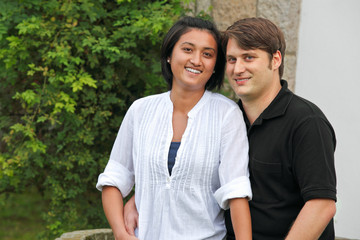 Young couple smiling into camera