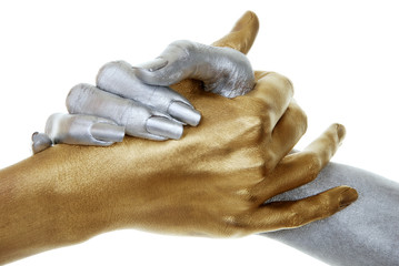 closeup of gold and silver hands