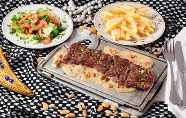 Grilled meat with almond sauce