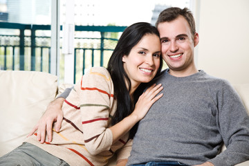 Happy couple relaxing at home