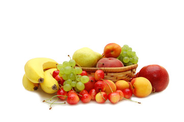 Fresh fruit in a wattled basket on a white background