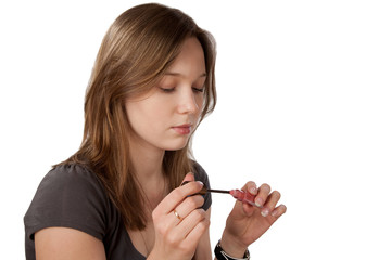 girl with  tube of lipstick isolated