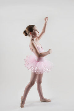7 year old girl practicing ballet in tutu
