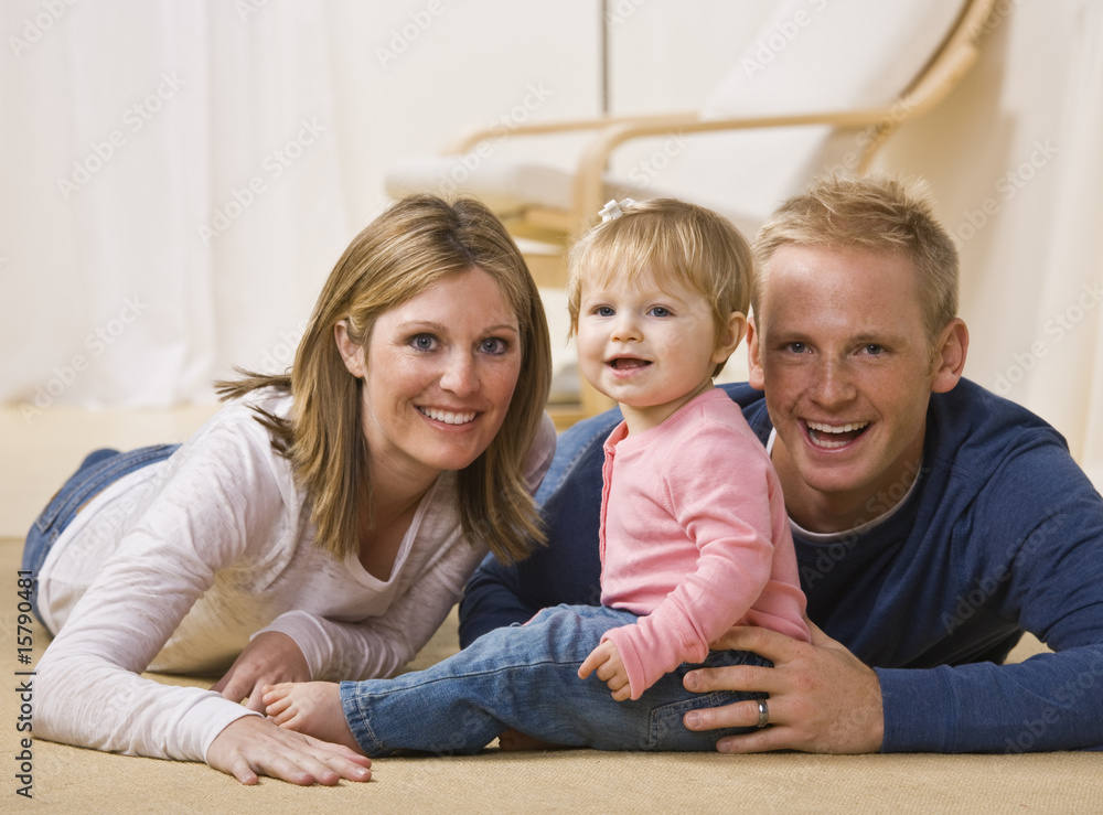 Wall mural young family smiling