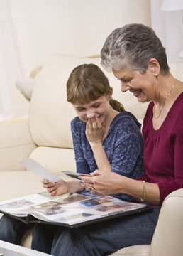 Grandmother and Granddaughter Looking at Photos