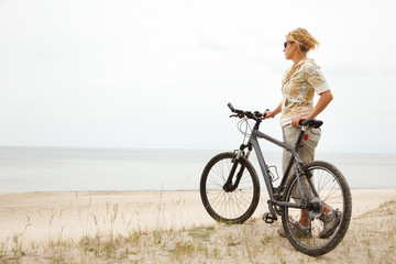 Fototapeta premium Young women with bicycle