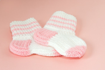 Two hand-made baby socks