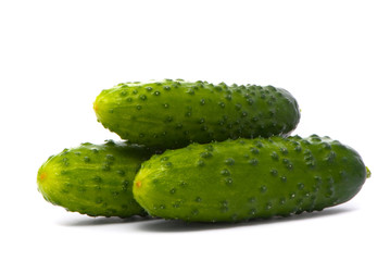Fresh cucumbers on studio white