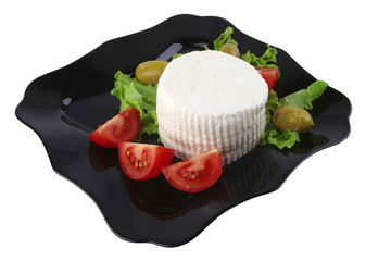 soft feta cheese on black dish