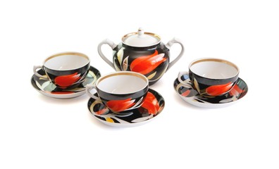 Obraz na płótnie Canvas Black tea service of three cups and sugar basin isolated