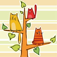 Three funny kittens on a tree