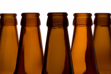Closeup of empty bottles on a gleam