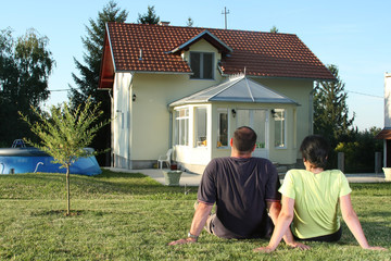 Couple in front of house 2