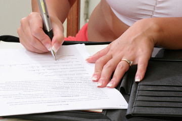 Woman's hands writing