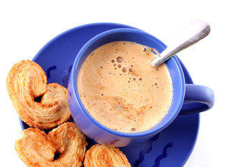 Cup of coffee with milk and cookies isolated over white backgrou