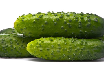 Fresh cucumbers on studio white