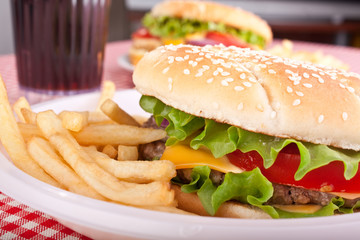 two cheeseburgers with  fries