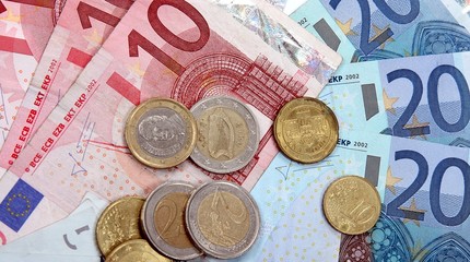 Euro banknotes with coins, financial background