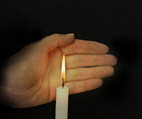 Candle and hand