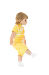 Walking girl in yellow shirt and pants