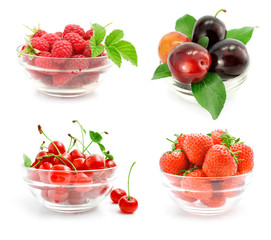 fresh fruits with green leaves in the glass vase