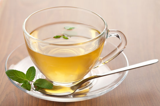 cup of green tea with mint