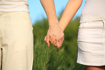 man's and female's hands to be held for each other