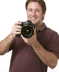 Fototapeta premium A portrait of a attractive man holding a camera